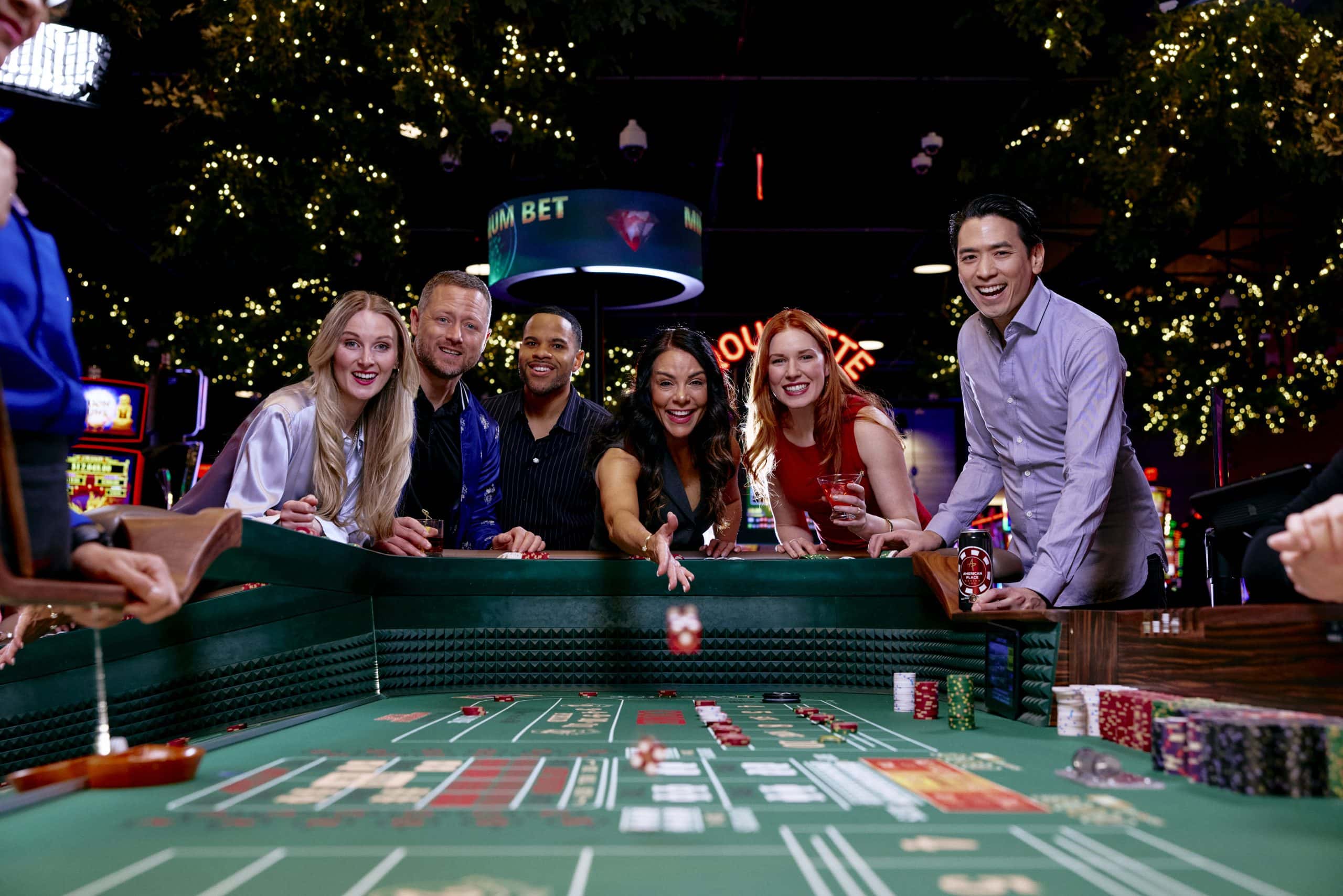 Group of friends playing roulette at American Place Casino in Waukegan, IL.