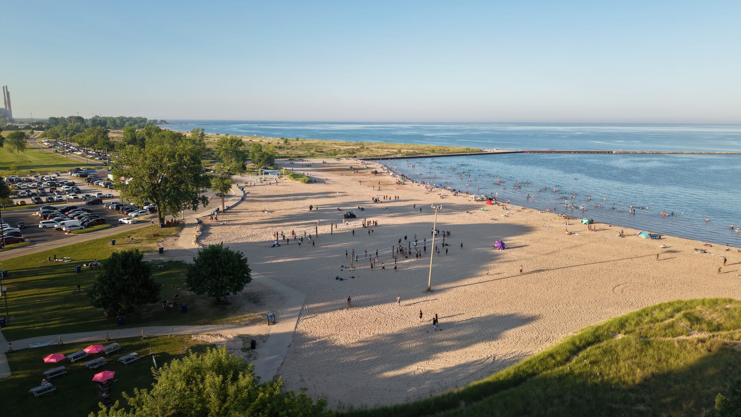 Scenic view of Waukegan Municipal Beach on Lake Michigan with visitors and shoreline.