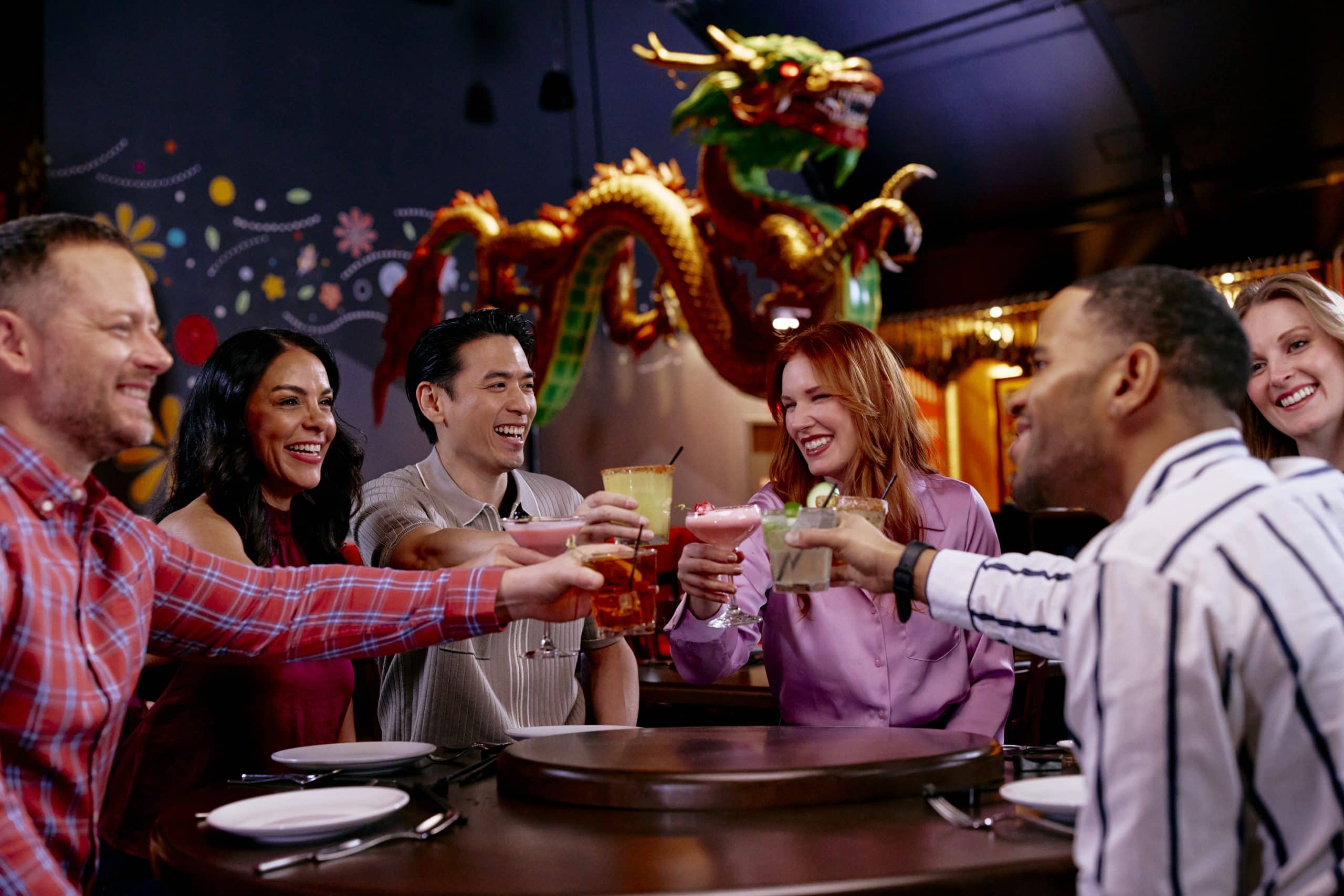 Group of friends enjoying drinks at Asian-Azteca restaurant in Waukegan IL.