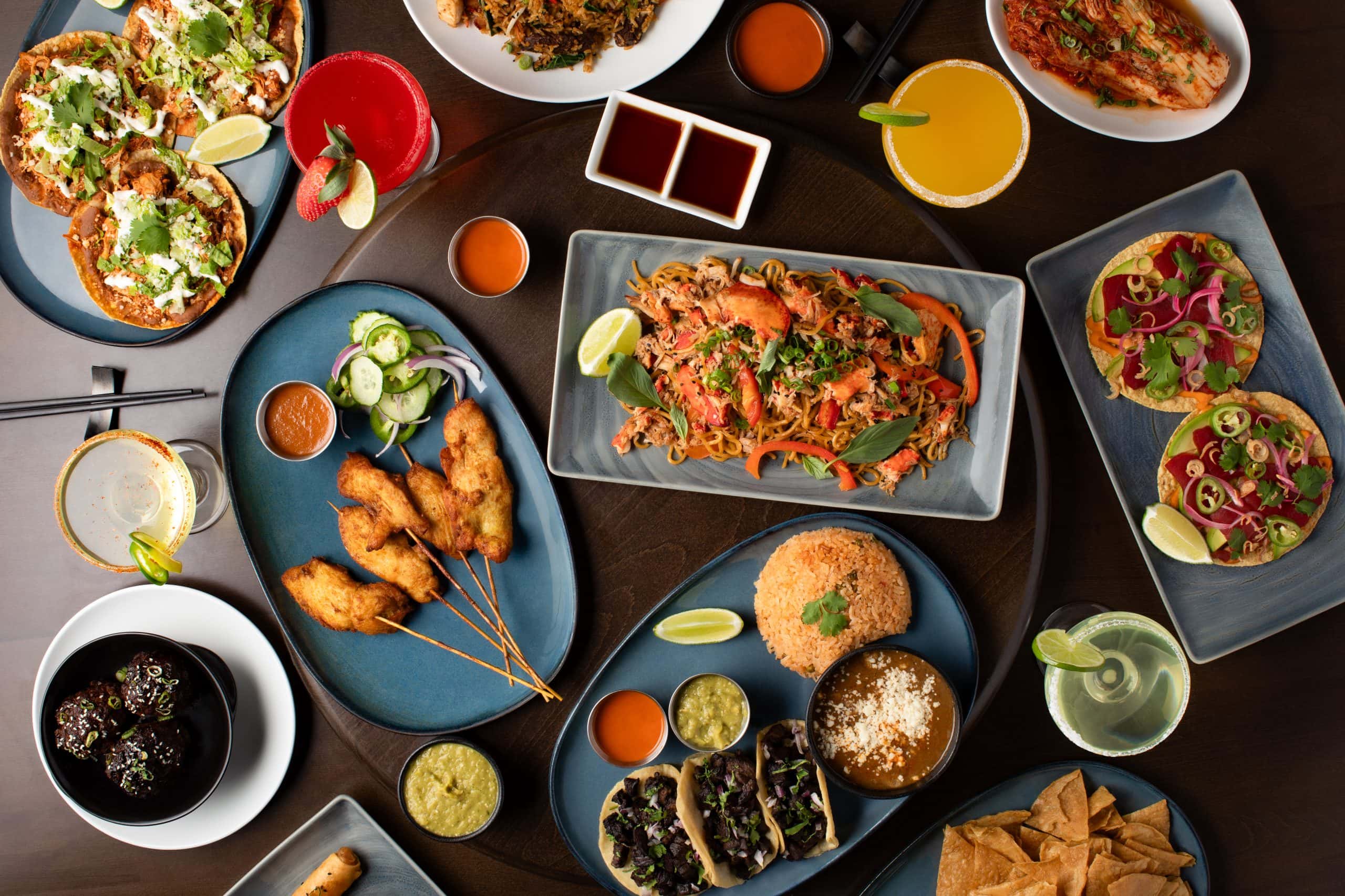 Assorted Asian and Mexican dishes served on a table in Waukegan, IL.