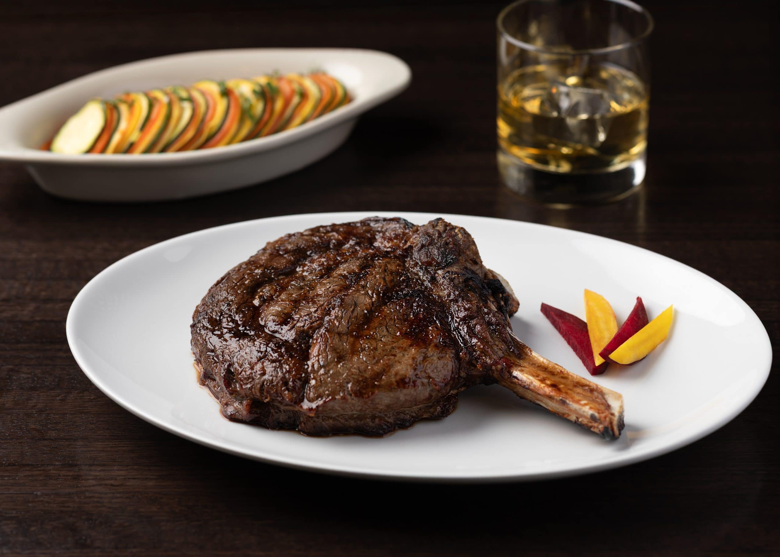 Juicy grilled steak with side vegetables at Northshore Steaks & Seafood.