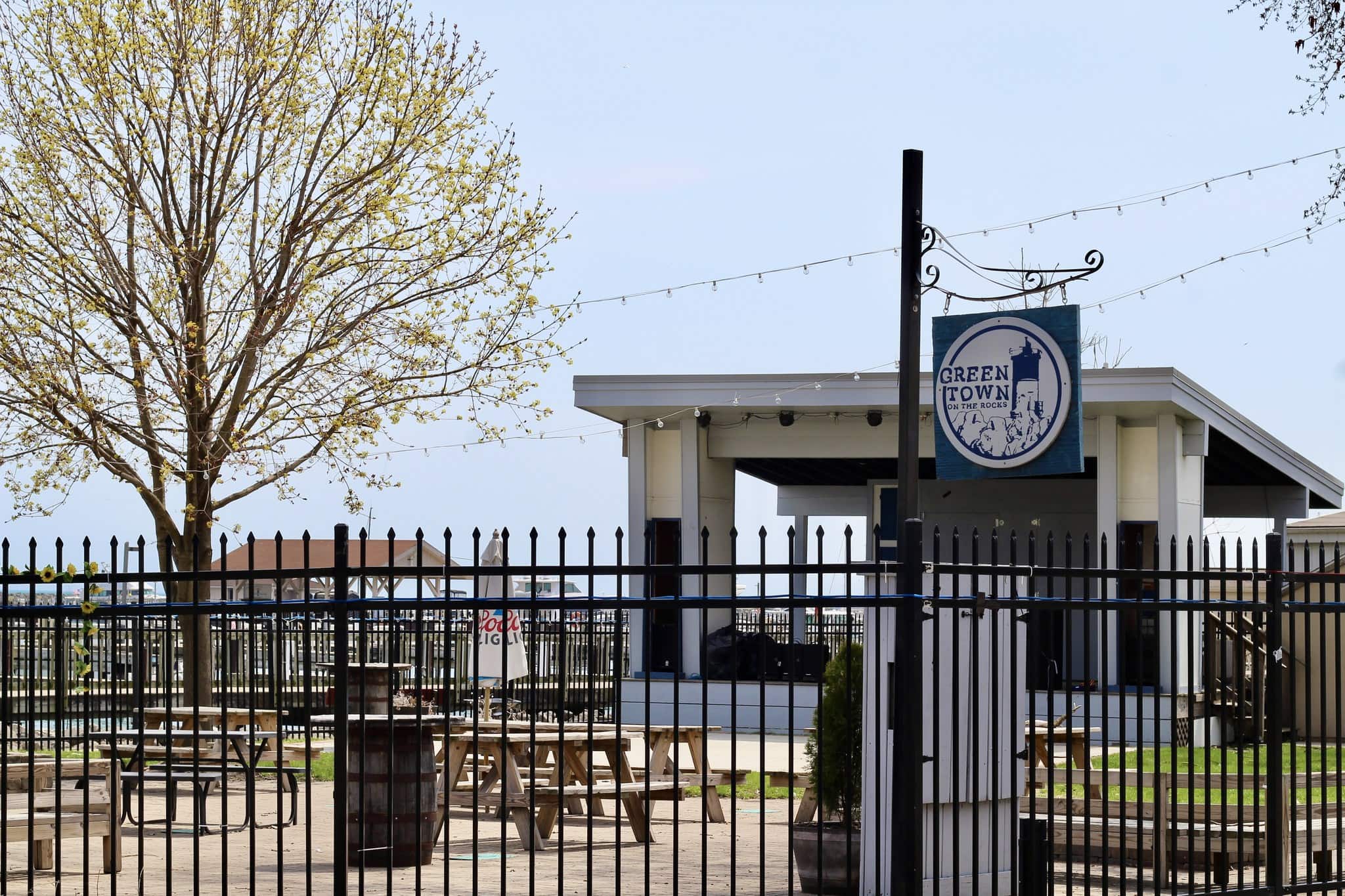 Waukegan Green Town pavilion with outdoor seating and string lights.